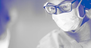 Female surgeon during operation