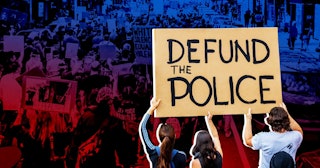 participant holding a Defund The Police sign at the protest. Thousands of protesters filled the stre...