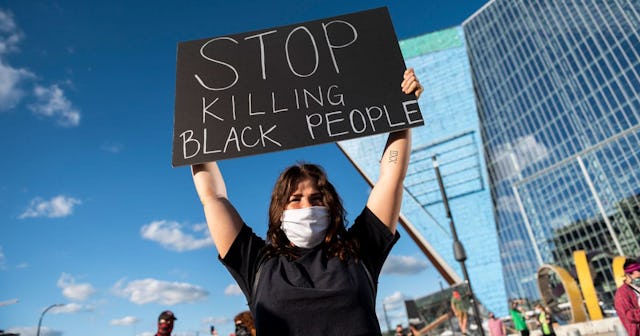 rotesters march by U.S. Bank Stadium in response to the police killing of George Floyd on May 29, 20...