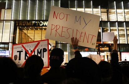 Dozens of anti-Donald Trump protesters stand along 5th Avenue in front of Trump Tower as New Yorkers...
