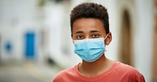 teenager wearing face mask for COVID-19