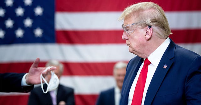 US President Donald Trump tours a Honeywell International Inc. factory producing N95 masks during hi...
