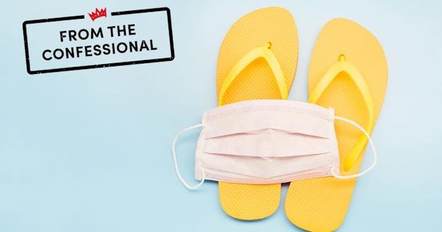Still life of a white face mask and orange flip-flops on blue background, on vacation with a protect...