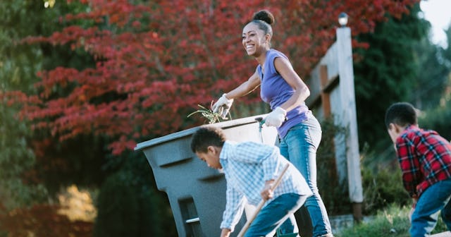 how to compost, woman gardening with two children