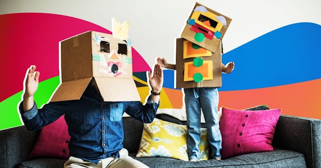 Father and daughter wearing robot costumes at home
