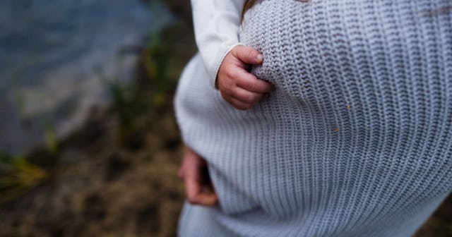 mother holding baby