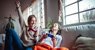 Mother and daughter playing video games