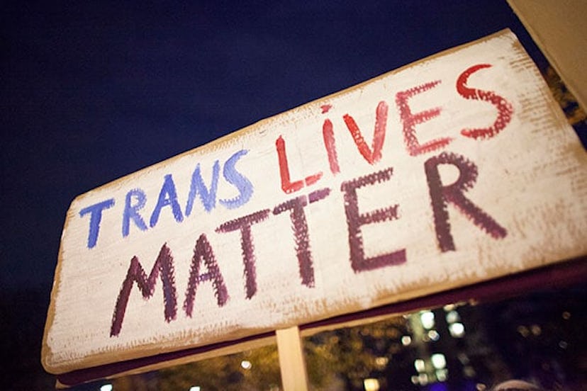 Trans lives matter banner during We wont be erased LGBTQ protest near US embassy in Warsaw on Octobe...