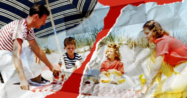 A woman with a girl in matching clothes and a man with a boy striped shirts at the beach, New York S...