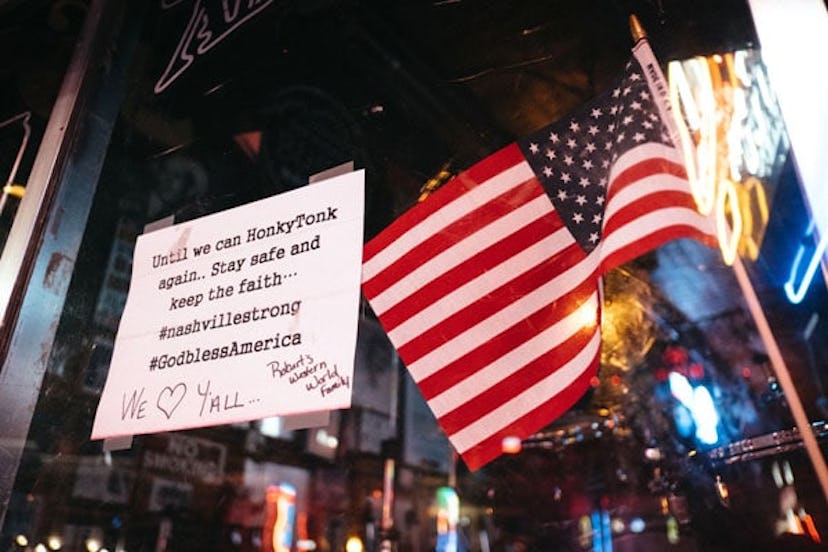 A sign is posted on the door of a bar in Downtown Broadway is seen at night on April 8, 2020 in Nash...