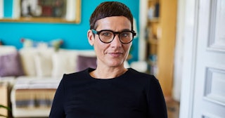 Portrait of smiling woman wearing glasses at home