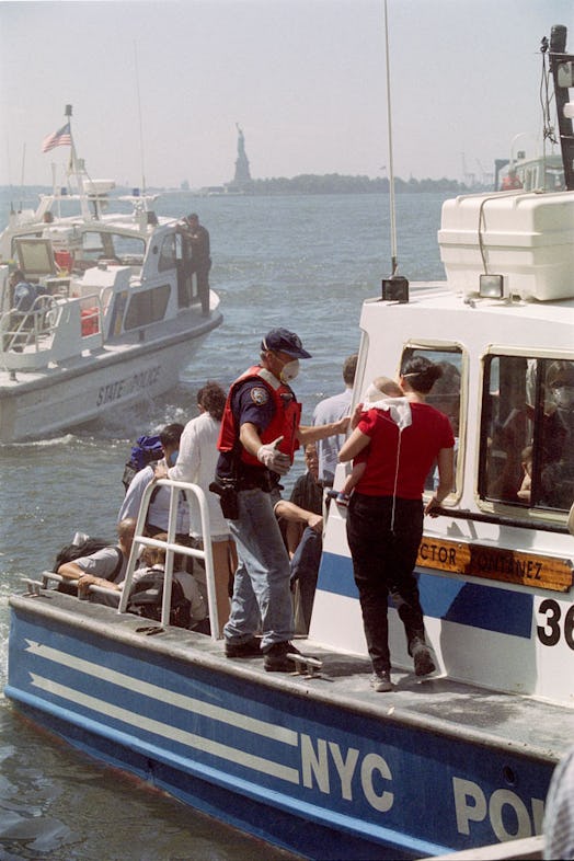 People are evacuated by boat after the attack on the World Trade Center on September 11, 2001.
