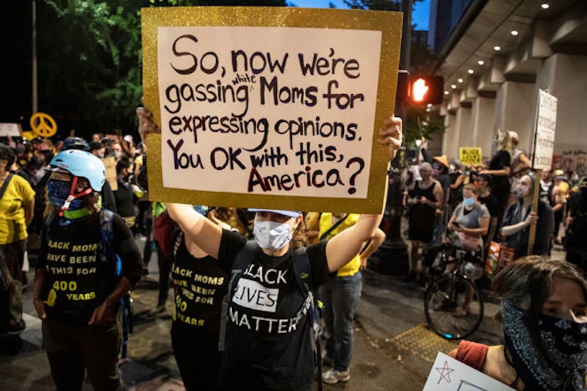 The Moms group protesters marches at the nightly protest in front of the Mark O. Hatfield U.S. Court...