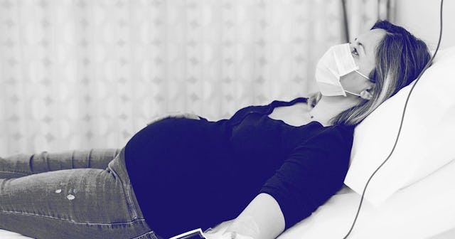 Pregnant Woman Rests in Hospital bed with IV