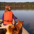 Maybe Forced Family Fun Is The Pandemic Prescription We Need: child and dog in boat