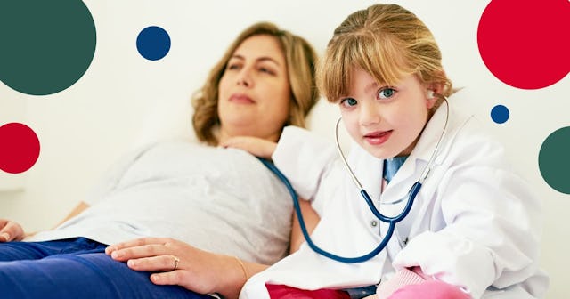 Portrait of an adorable little girl dressed up as a doctor and examining a woman with a stethoscope