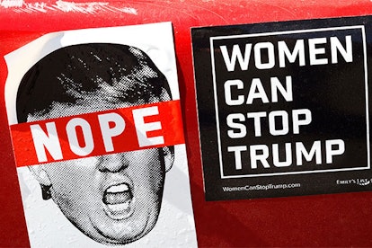 Two anti-Trump bumper stickers are affixed to a car in Santa Fe, New Mexico
