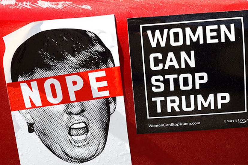 Two anti-Trump bumper stickers are affixed to a car in Santa Fe, New Mexico