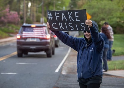 Demonstrators hold a "Rolling Car Rally" in front of Democratic Governor Ned Lamont's residence whil...