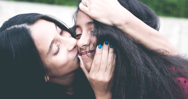 There Is Something About A Mother-Daughter Bond: mother kissing daughter on cheek
