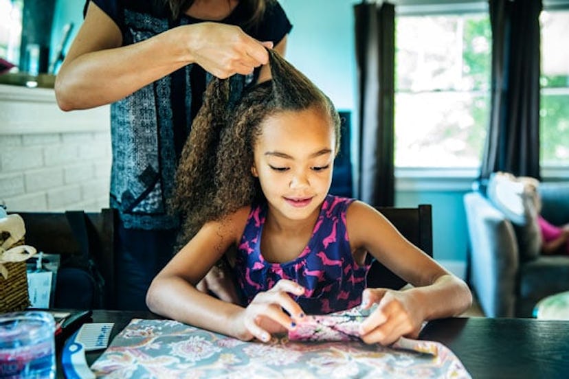 Normalize Checking In With Our Kids – It’s A Game-Changer: Close up of mother braiding hair of daugh...
