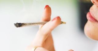 Close-Up Of Woman Smoking Weed