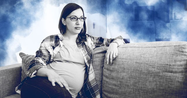 Pregnant woman sitting on couch