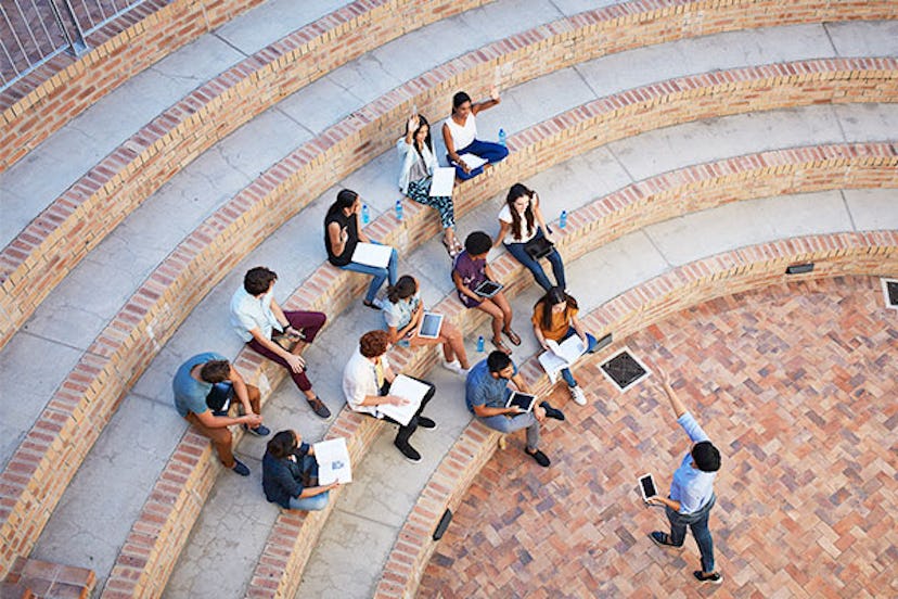 Students having class in outside auditorium