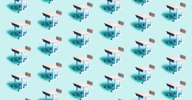 Pattern of empty school desks on a blue background.