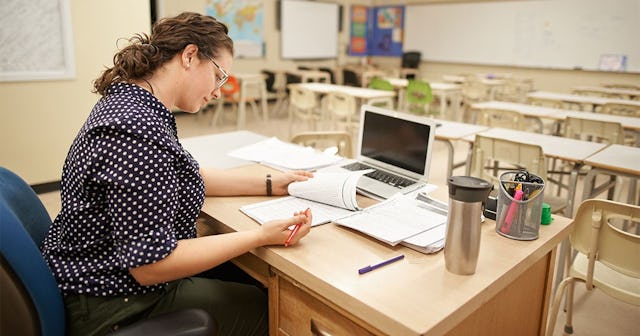 Shot of a female teacher working at her desk