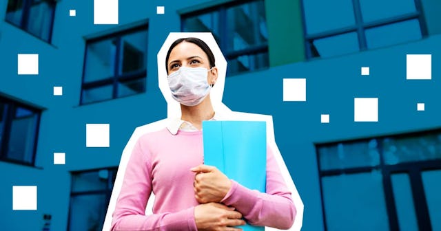 Low angle view of teacher with face mask after lockdown