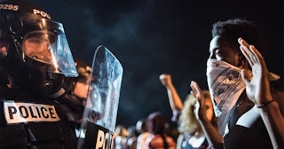 Police officers face off with protesters on the I-85 (Interstate 85) during protests in the early ho...