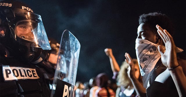 Police officers face off with protesters on the I-85 (Interstate 85) during protests in the early ho...