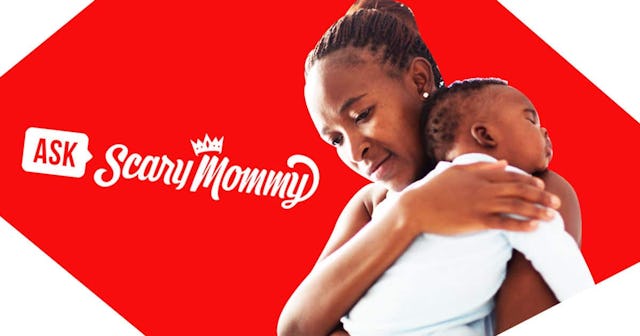 mother holding sleeping baby