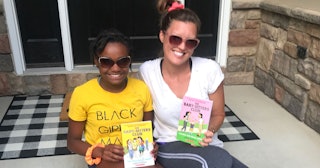 I'm Bonding With My Tween Over 'The Baby-Sitters Club': mother and daughter holding up books