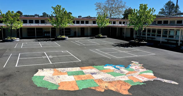 A cmap of the United States is painted on the playground at Kent Middle School on April 01, 2020 in ...
