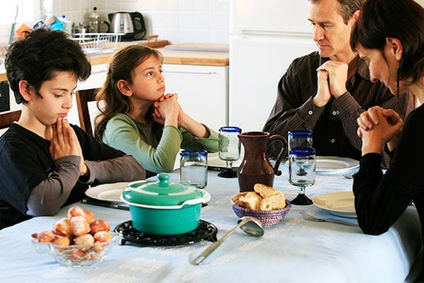 Family Praying Before Meal