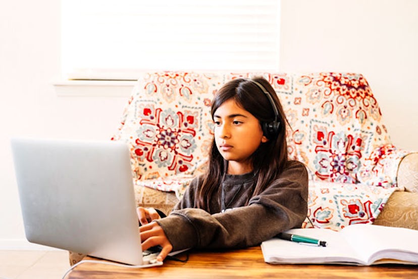 : Girl Doing Her Homework on Computer