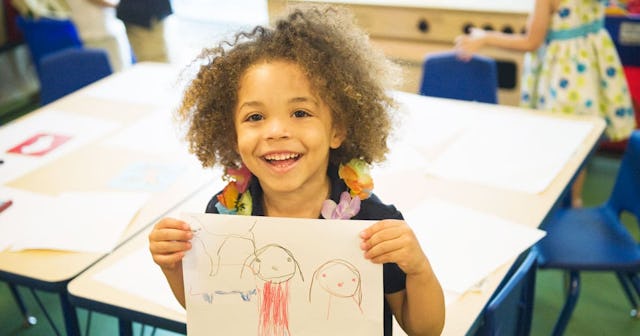 boy showing off drawing