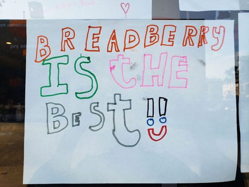 A child's drawing with a sign that says "Breadberry is the best" 