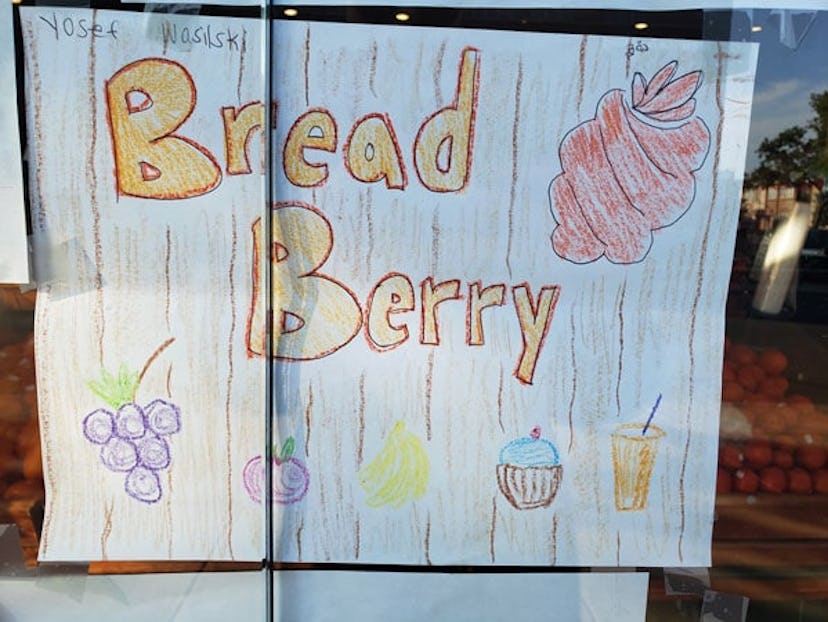 A child's drawing of a Breadberry logo surrounded by groceries
