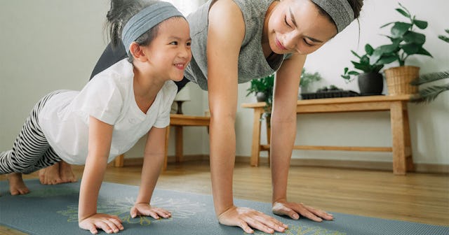 Mother and daughter doing yoga