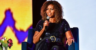 A conversation with Michelle Obama takes place during the 2019 ESSENCE Festival at the Mercedes-Benz...