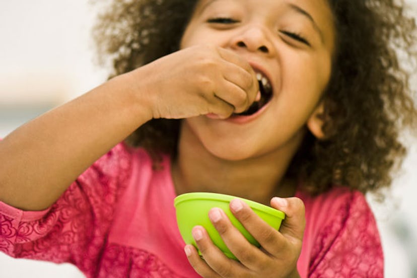 Little girl eating snack