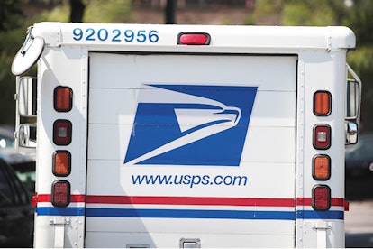 Why We Absolutely Must Save The USPS: A postal worker leaves a United State Postal Service facility ...