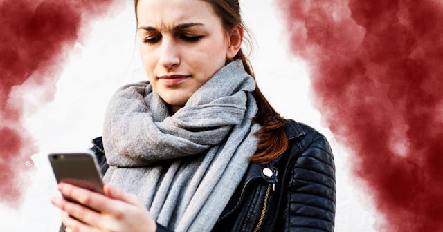 Frustrated young woman using her smartphone