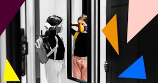 Young girl putting on her face mask in mirror by front door