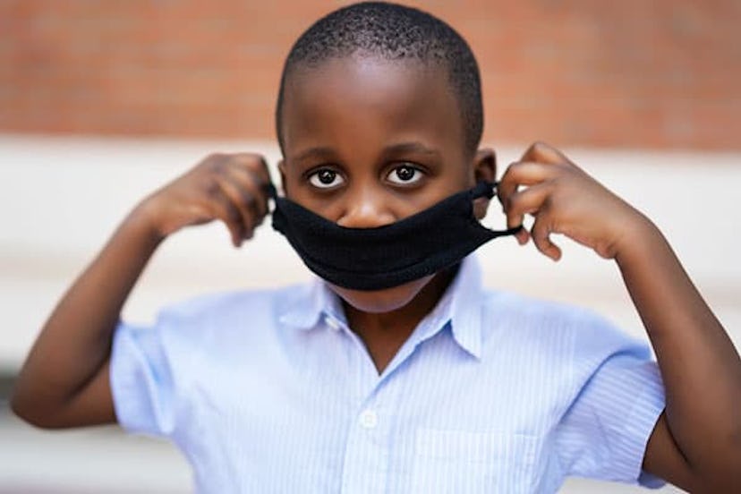 boy with protective mask to avoid covid19