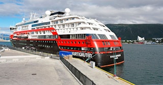 the expedition cruise ship MS Roald Amundsen is moored at a quay in Tromso, northern Norway, on Augu...