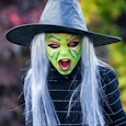 Girl in witch makeup and costume — Halloween makeup ideas for kids.